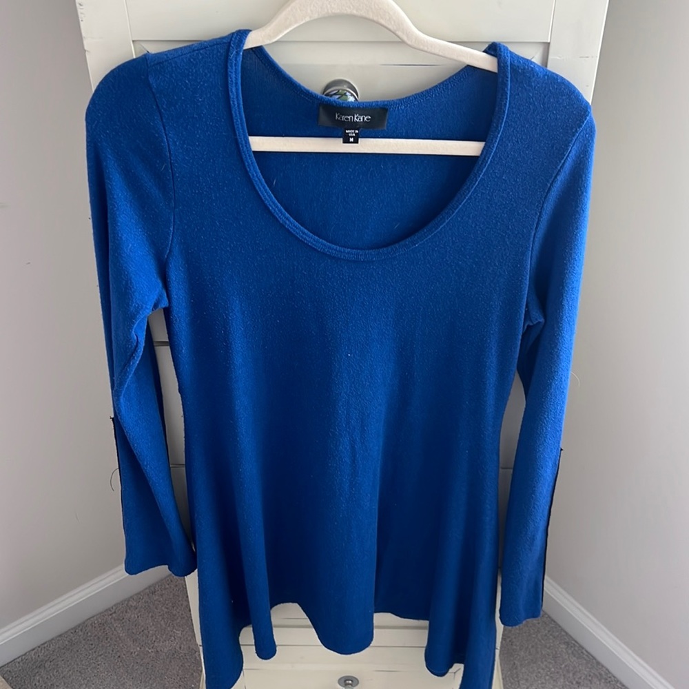Royal blue sweater with leather on sleeves. Size M